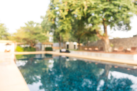 Abstract blur defocused swimming pool in luxury hotel resort for backgroundの写真素材