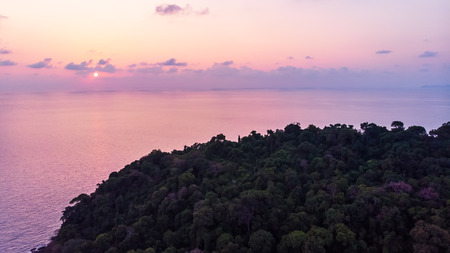 Aerial view of beautiful beach and sea with coconut palm tree at sunset time on paradise islandの写真素材