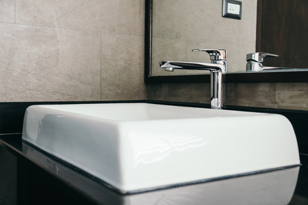 Faucet and sink decoration in bathroom interiorの写真素材