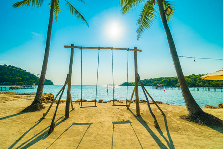 Swing on the beach Beautiful tropical beach and sea with coconut palm tree in paradise island for travel and vacationの写真素材
