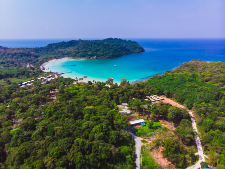 Aerial view of beautiful beach and sea with coconut palm tree on blue sky in the paradise islandの写真素材