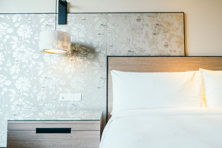 White pillow on bed decoration interior of hotel bedroomの写真素材