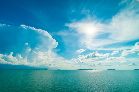 Beautiful white cloud on blue sky and sea or ocean for backgroundの写真素材