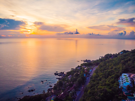 Aerial view of beautiful tropical beach and sea with palm and other tree in koh samui island Thailand at sunset time for vacation and travelの写真素材