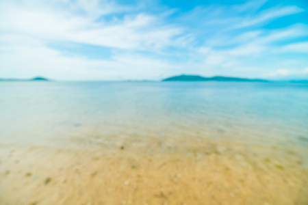 Abstract blur and defocused tropical beach and sea with coconut palm tree background for travel and vacationの写真素材