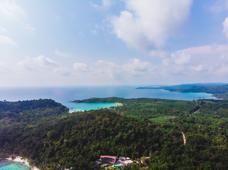 Aerial view of beautiful beach and sea with coconut palm tree on blue sky in the paradise islandの写真素材