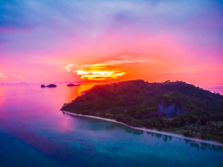Aerial view of beautiful tropical beach and sea with palm and other tree in koh samui island Thailand at sunset time for vacation and travelの写真素材