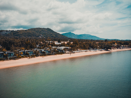 Aerial view of beautiful tropical beach and sea with palm and other tree in koh samui island for travel and vacationの写真素材