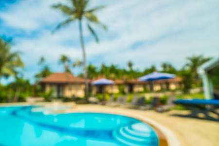 Abstract blur and defocused outdoor swimming pool in hotel and resort background for travel and vacationの写真素材