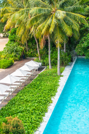 Beautiful luxury umbrella and chair around swimming pool in hotel and resort for travel and vacationのeditorial素材