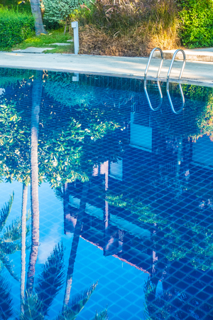 Beautiful luxury outdoor swimming pool with stair in hotel and resort for holiday travel and vacationの写真素材