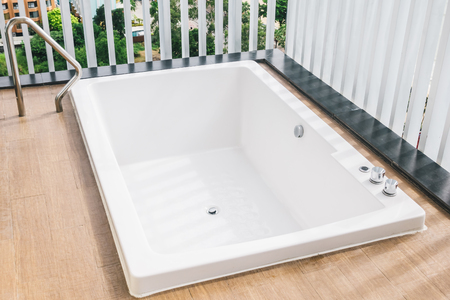 Beautiful white bathtub and hot tub bath decoration outdoor exterior of balcony or patioの写真素材