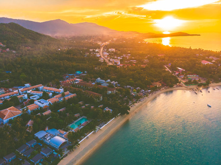 Aerial view of beautiful tropical beach and sea with palm and other tree in koh samui island...