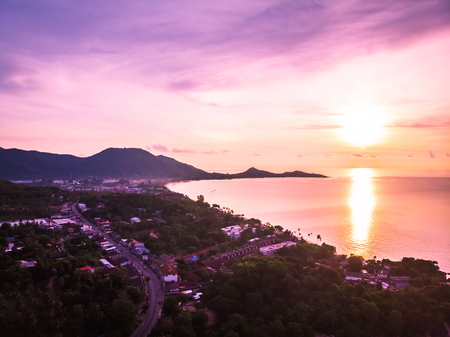 Aerial view of beautiful tropical beach and sea with palm and other tree in koh samui island Thailand at sunrise time for vacation and travelの写真素材