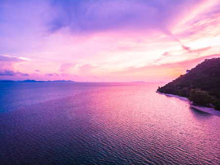 Aerial view of beautiful tropical beach and sea with palm and other tree in koh samui island Thailand at sunset time for vacation and travelの写真素材