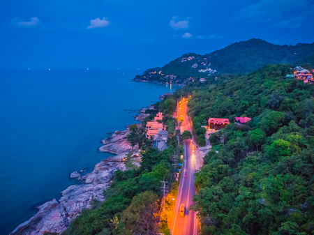 Aerial view of beautiful tropical beach and sea with palm and other tree in koh samui island Thailand at sunset time for vacation and travelの写真素材