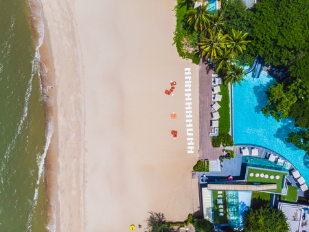 Aerial view of swimming pool with sea and beach in luxury hotel and resort for travel and vacationのeditorial素材