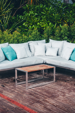 Comfortable pillow on sofa decoration outdoor patio with tropical and nature view