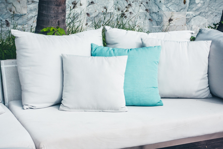 Comfortable pillow on sofa decoration outdoor patio with tropical and nature viewの写真素材