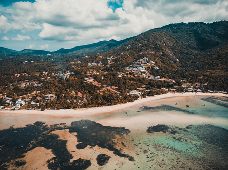 Aerial view of beautiful tropical beach and sea with palm and other tree in koh samui island for...