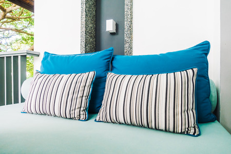 Comfortable pillow on sofa decoration outdoor patio with tropical and nature viewの写真素材