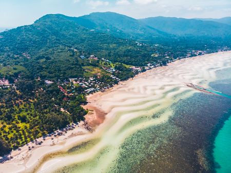 Aerial view of beautiful tropical beach and sea with trees on island for travel and vacationの写真素材