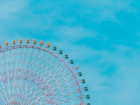 Ferris wheel in the park with blue sky background - Vintage Filterの写真素材