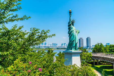 Liberty statue with rainbow bridge in odaiba island tokyo japanのeditorial素材