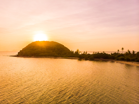 Aerial view of beautiful tropical beach and sea in island at sunset time for travel and vacationの写真素材