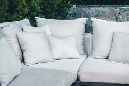 Comfortable pillow on sofa decoration outdoor patio with tropical and nature viewの写真素材