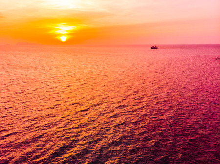 Aerial view of beautiful tropical beach and sea in island at sunset time for travel and vacationの写真素材