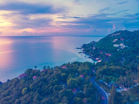 Aerial view of beautiful tropical beach and sea with palm and other tree in koh samui island Thailand at sunset time for vacation and travelの写真素材