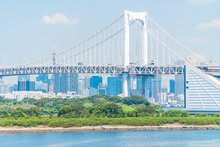 Beautiful architecture building cityscape of tokyo city with rainbow bridge in japanの写真素材