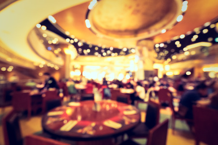 Abstract blur and defocused hotel buffet restaurant and coffee shop cafe interior for backgroundの写真素材