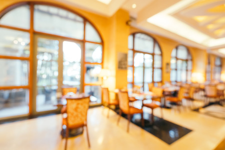 Abstract blur and defocused breakfast buffet in hotel restaurant and coffee shop cafe interior for backgroundの写真素材