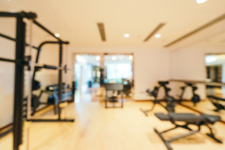 Abstract blur and defocused fitness equipment in gym room interior for backgroundの写真素材