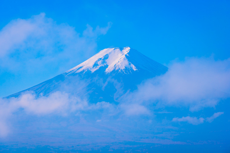 Beautiful landscape of mountain fuji around maple leaf tree with white cloud and blue sky in autumn season at Yamanashi Japanの写真素材