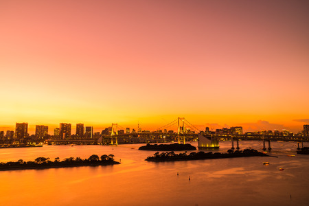 Beautiful architecture building cityscape of tokyo city with rainbow bridge at twilight sunset time in japanの写真素材