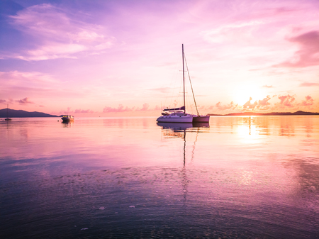 Aerial view of beautiful tropical beach and sea with palm and other tree in koh samui island Thailand at sunset time for vacation and travelの写真素材