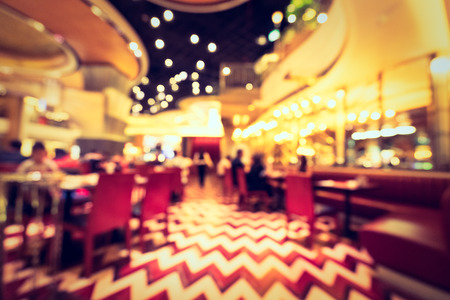Abstract blur and defocused hotel buffet restaurant and coffee shop cafe interior for backgroundの写真素材