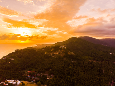 Aerial view of beautiful tropical beach and sea in island at sunset time for travel and vacationの写真素材