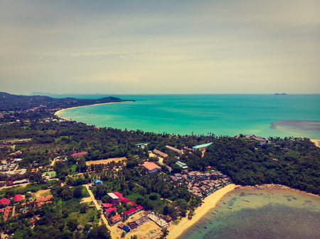 Aerial view of beautiful tropical beach and sea with trees on island for travel and vacationの写真素材