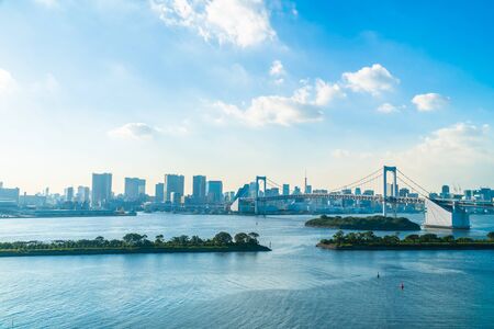 Beautiful architecture building cityscape of tokyo city with rainbow bridge in japanの写真素材