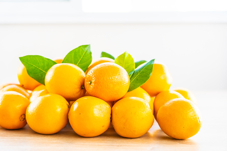 Fresh oranges fruit on wood table - Healthy food conceptの写真素材