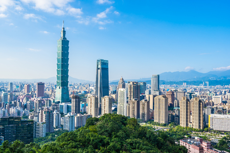 Beautiful landscape and cityscape of taipei 101 building and architecture in the city skyline with bluesky and white cloud at Taiwanの写真素材