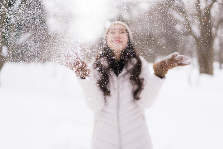 Beautiful young asian woman smiling happy with travel in snow winter season at Hokkaido Japanの写真素材