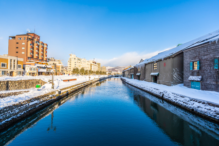 Beautiful landscape and cityscape of Otaru canal river in winter and snow season at Hokkaido Japanのeditorial素材