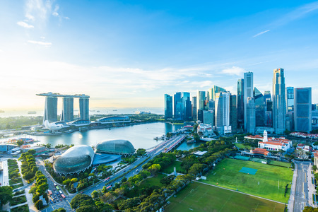 Beautiful architecture building exterior cityscape in Singapore city skyline with white cloud on blue skyのeditorial素材