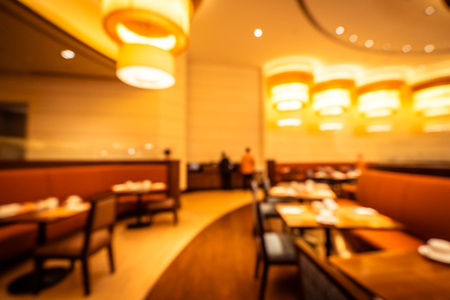 Abstract blur and defocused breakfast buffet in hotel restaurant and coffee shop cafe interior for backgroundの写真素材