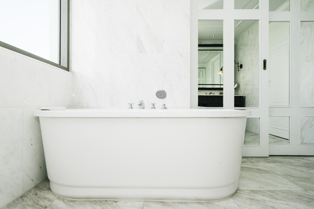 Beautiful luxury white and clean bathtub decoration in bathroom interiorの写真素材
